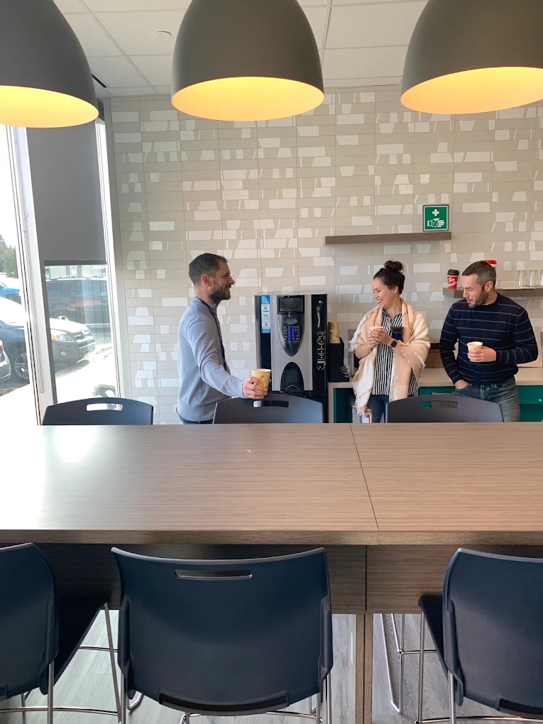 Modern office coffee bar setup with touchscreen